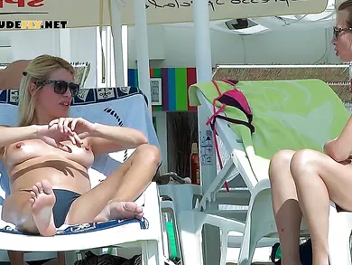 One gorgeous hot nude beach girl gets joined by her friend